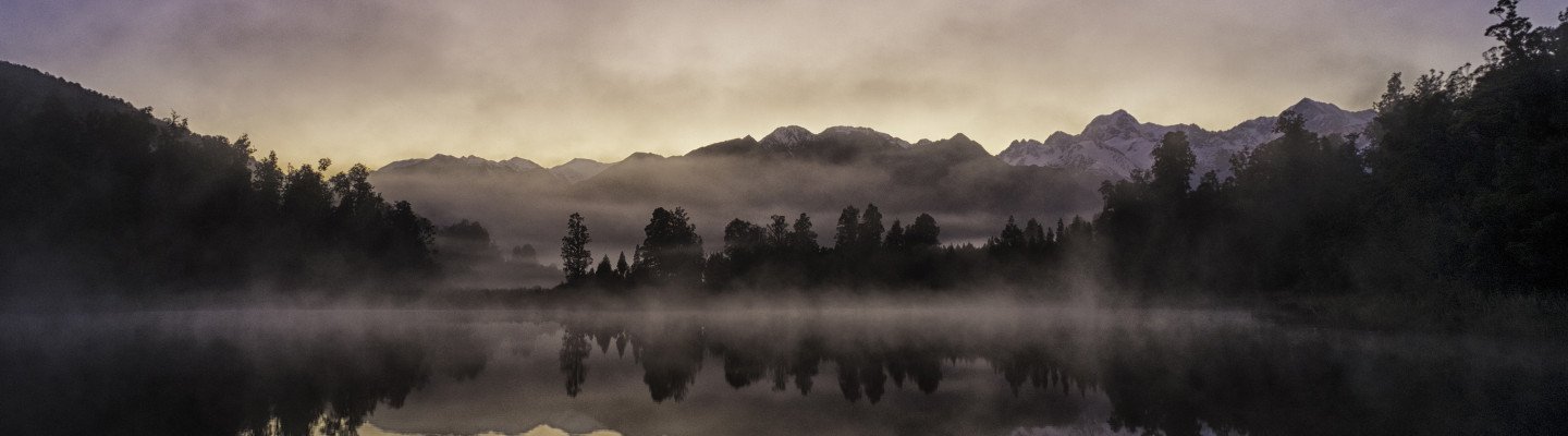 purple-sky-water-mountains