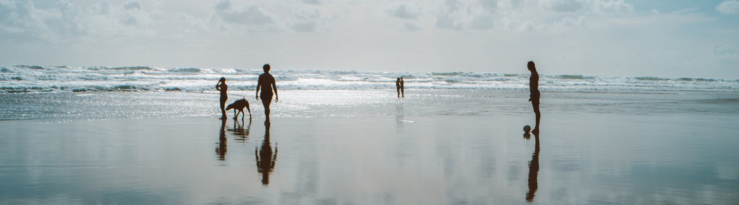 people standing on a beach