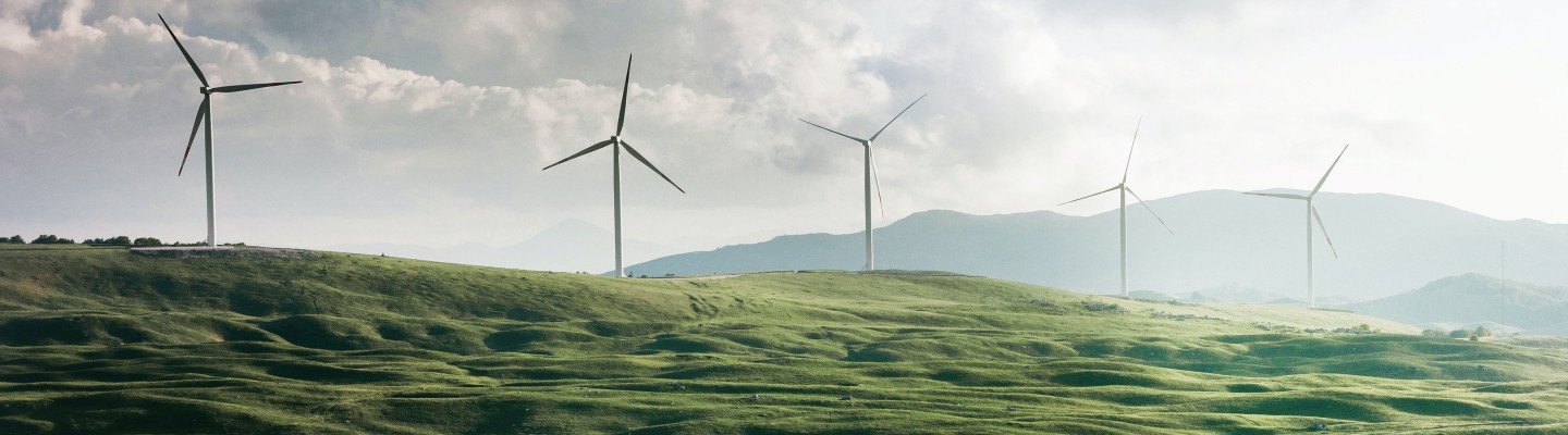 Windmills on green hills